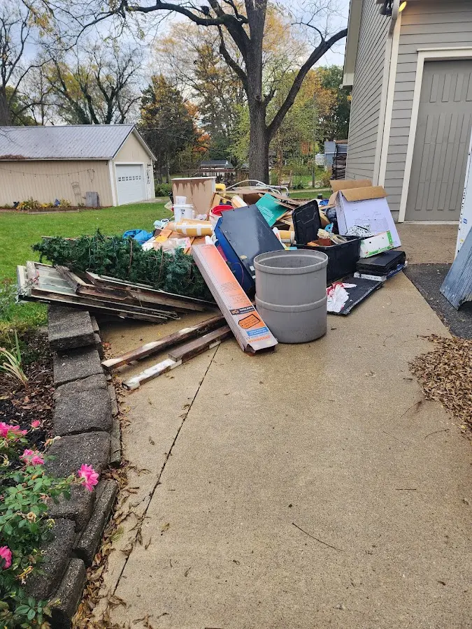 Dumpster being loaded with debris for Demolition Dumpster Rental in Woodward